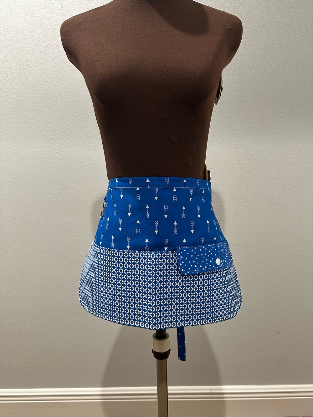 Blue Patterned Apron with Pockets across the front and a Snap Pocket